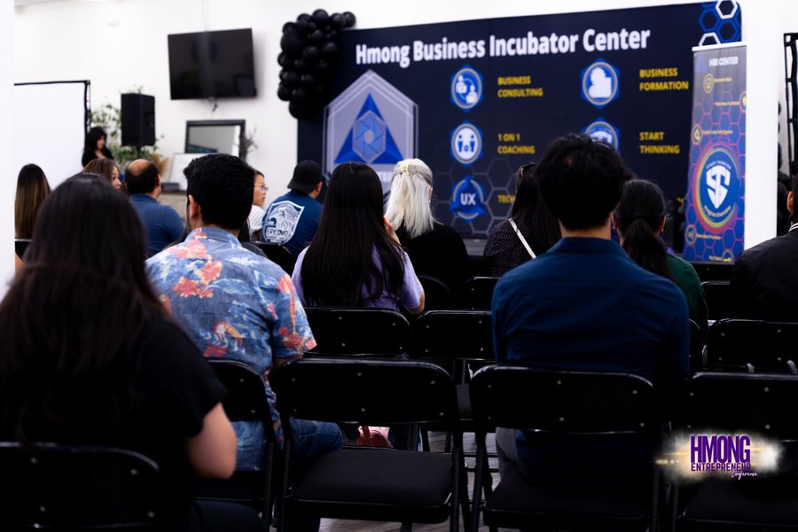 Attendees seated facing a Hmong Business Incubator Center presentation in Fresno.